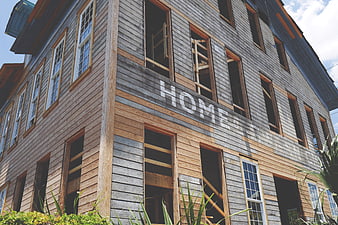 Old wooden house under renovation with exposed siding