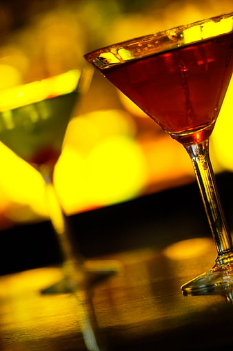 Close-up of Red and Green Cocktails in Martini Glasses