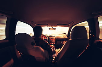 Cinematic Interior View of Driver in Car at Sunset