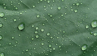 Macro Water Droplets on Green Textured Fabric