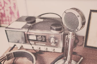 Vintage Microphone and Retro Radio on Wooden Desk
