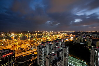 Aerial Night View of Industrial Port and City Skyline
