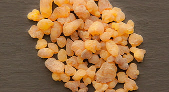 Raw Frankincense Resin Tears on Dark Slate Background