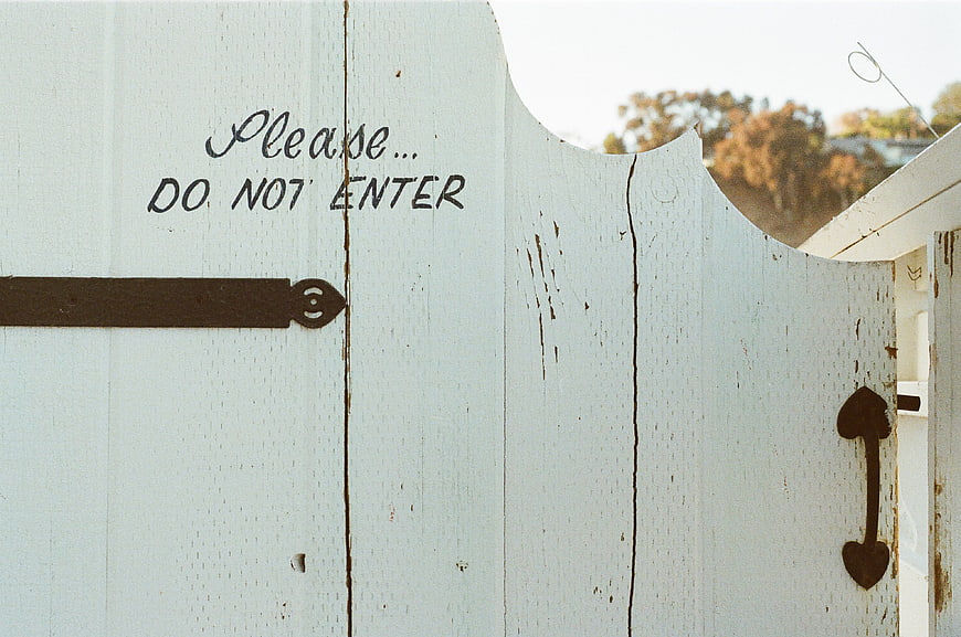 Vintage White Wooden Gate with Do Not Enter Sign