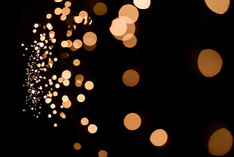 Golden Bokeh Lights on Black Background