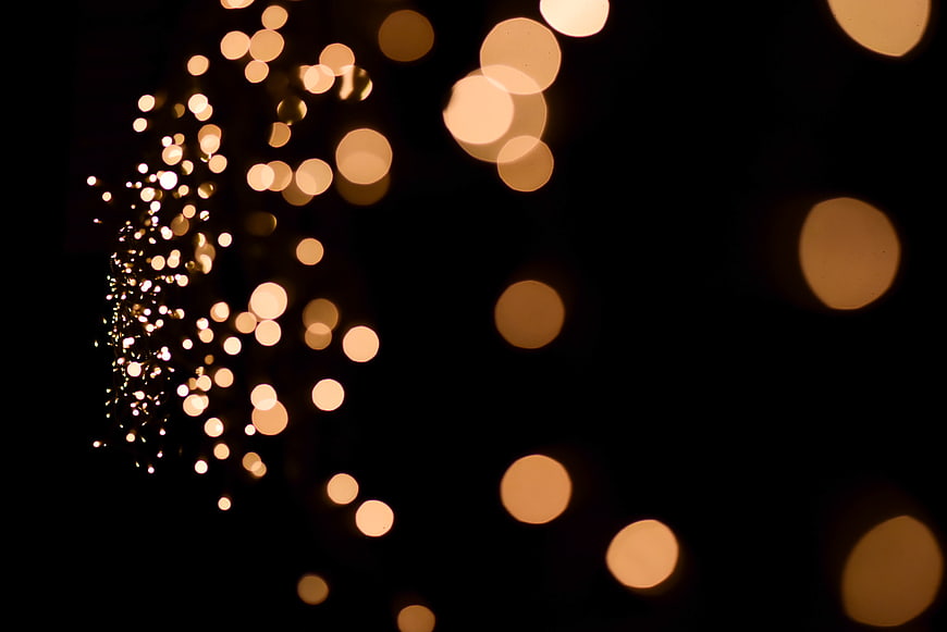 Golden Bokeh Lights on Black Background