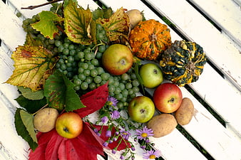 Autumn Harvest Arrangement of Fruits, Vegetables, and Leaves