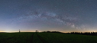 Panoramic Milky Way over Green Field at Night