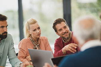 Diverse business team collaborating in modern office meeting
