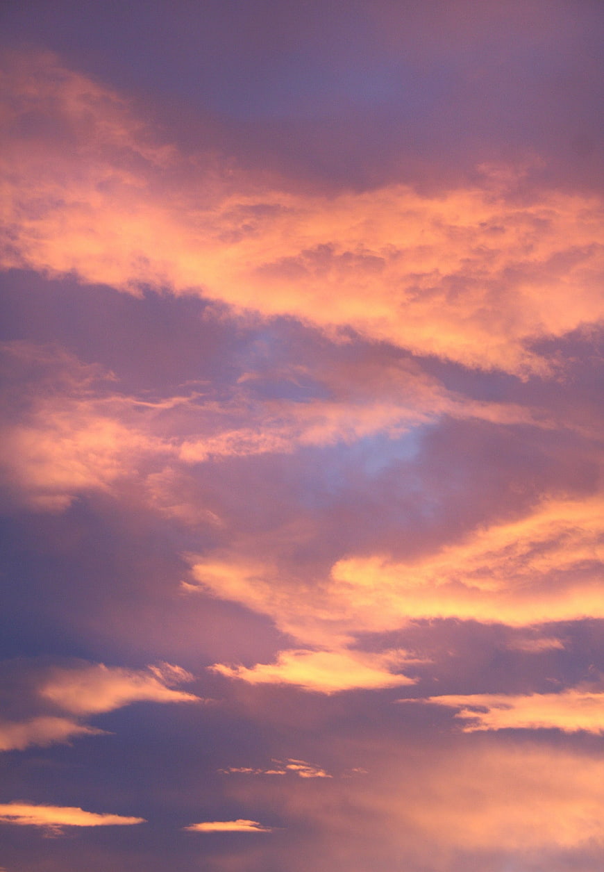 Vibrant Pink and Orange Sunset Clouds Sky Background