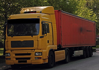 Yellow Scania Truck With Red Container Trailer Parked On Street