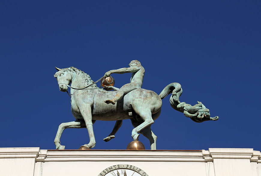 Bronze equestrian statue against clear blue sky