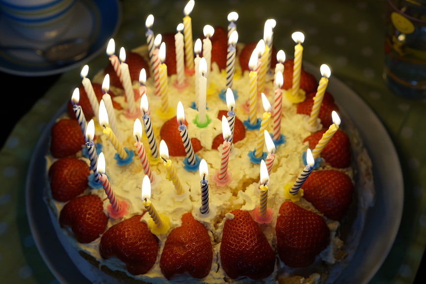 Strawberry Birthday Cake with Lit Candles