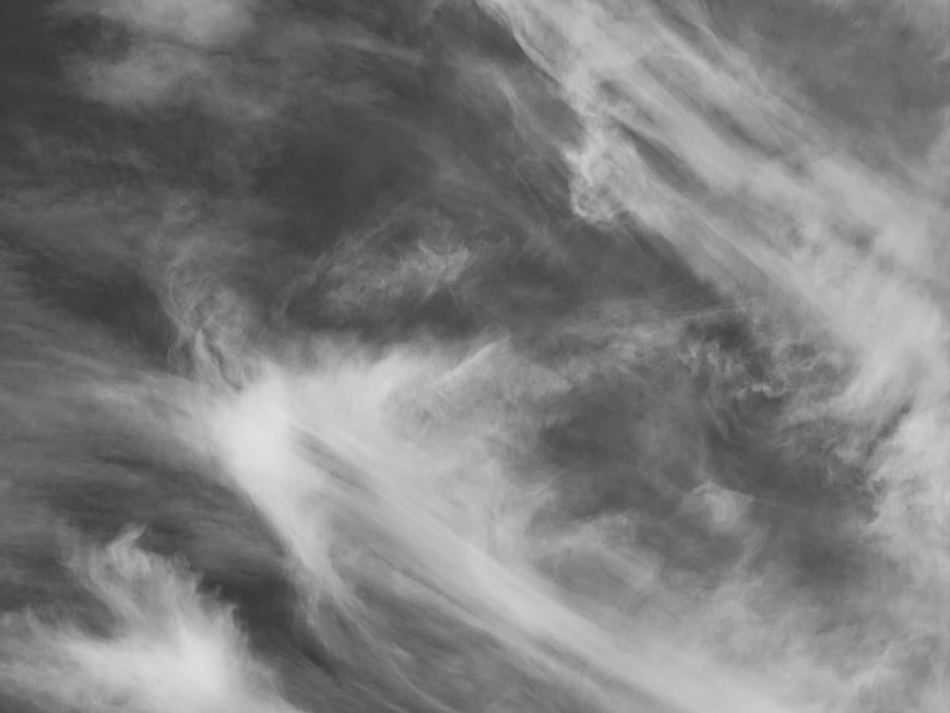 Abstract black and white swirling clouds texture background