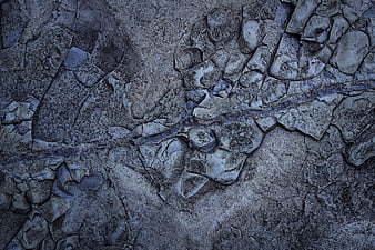 Aerial view of cracked gray and blue frozen lake surface