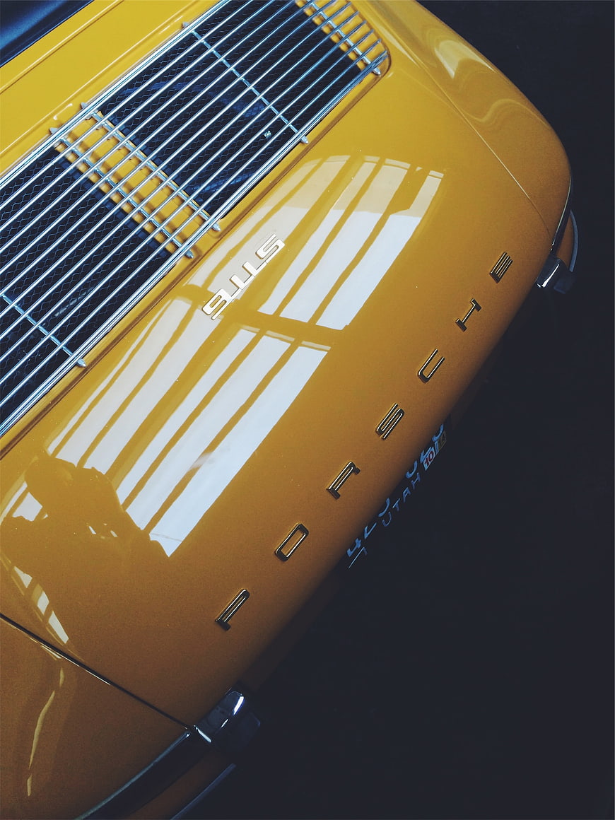 Close-up of Vintage Yellow Porsche 911S Hood and Grille