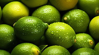 Fresh Green Limes with Water Droplets Close Up