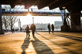 Couple Walking Under Bridge at Golden Hour in London