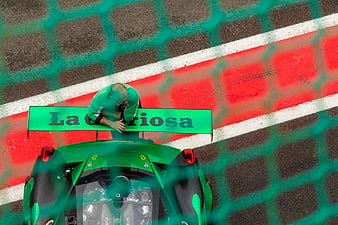 Top down view of green race car on track