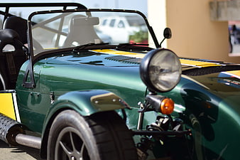 Close-up of Green Classic Sports Car with Yellow Stripes