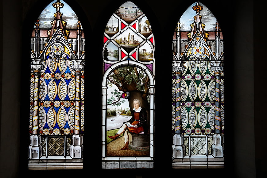 Ornate Gothic Stained Glass Window with Portrait