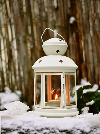 White Lantern with Candle in Snowy Winter Setting