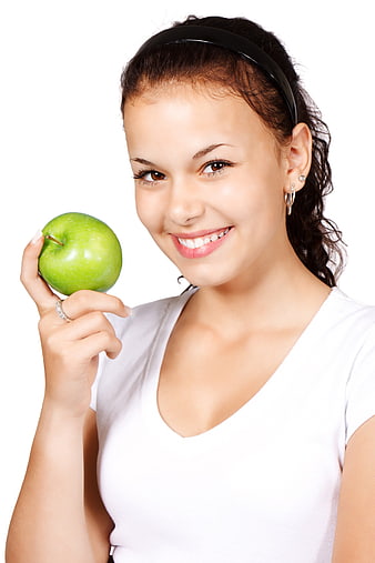 Smiling Woman Holding Green Apple Isolated on White