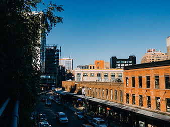 Urban Street Scene with Brick Buildings and Blue Sky