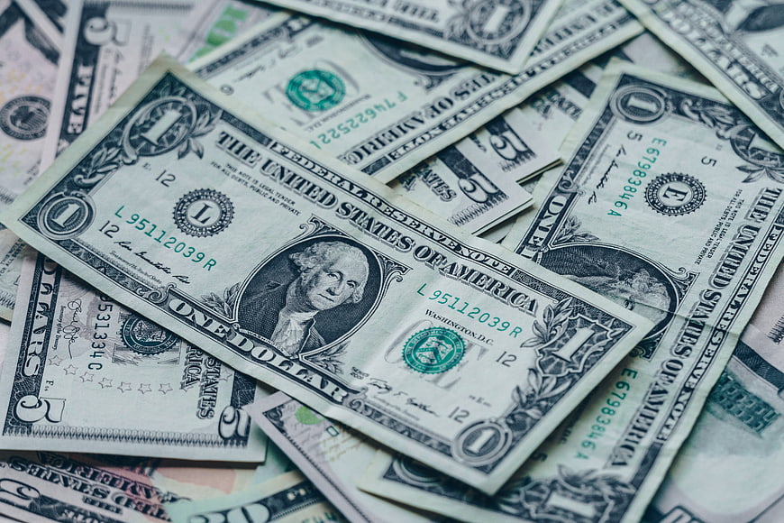 Scattered US Dollar Bills Close-Up