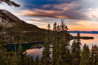 Sunset over Emerald Bay Lake Tahoe with Pine Trees