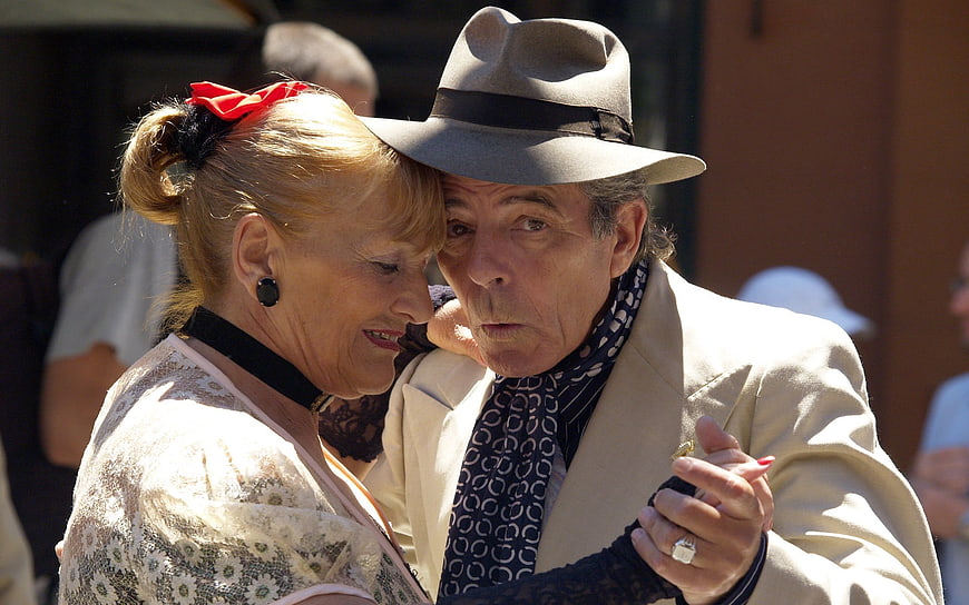 Senior couple dancing tango outdoors in Buenos Aires