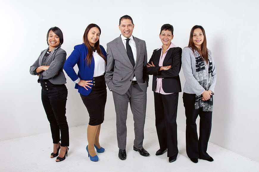 Diverse Business Team Standing Together in Professional Attire