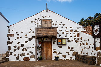 Traditional white stone house facade in Spanish village