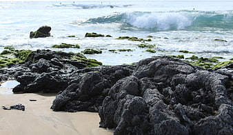 Rugged Coastal Rocks with Ocean Waves and Surf
