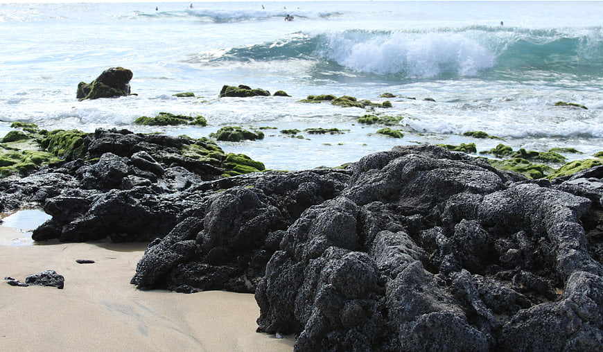 Rugged Coastal Rocks with Ocean Waves and Surf