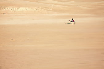 Lone Camel Rider Crossing Vast Sahara Desert Sand Dunes
