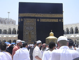 Muslim pilgrims praying near the Kaaba in Mecca