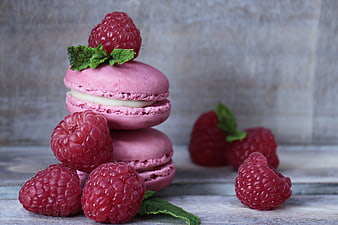Stack of Raspberry Macarons with Fresh Berries