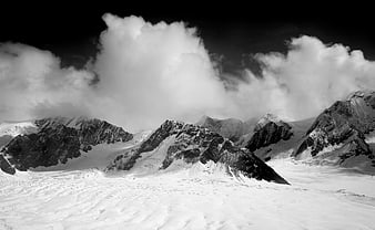 Dramatic Black and White Snowy Mountain Landscape at Night