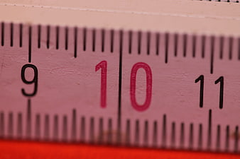 Close-up of pink folding ruler showing number 10