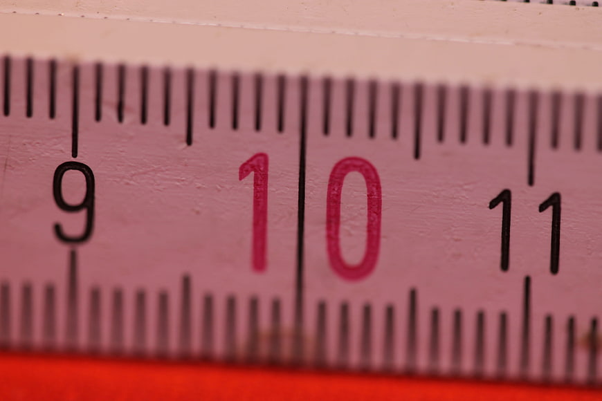 Close-up of pink folding ruler showing number 10