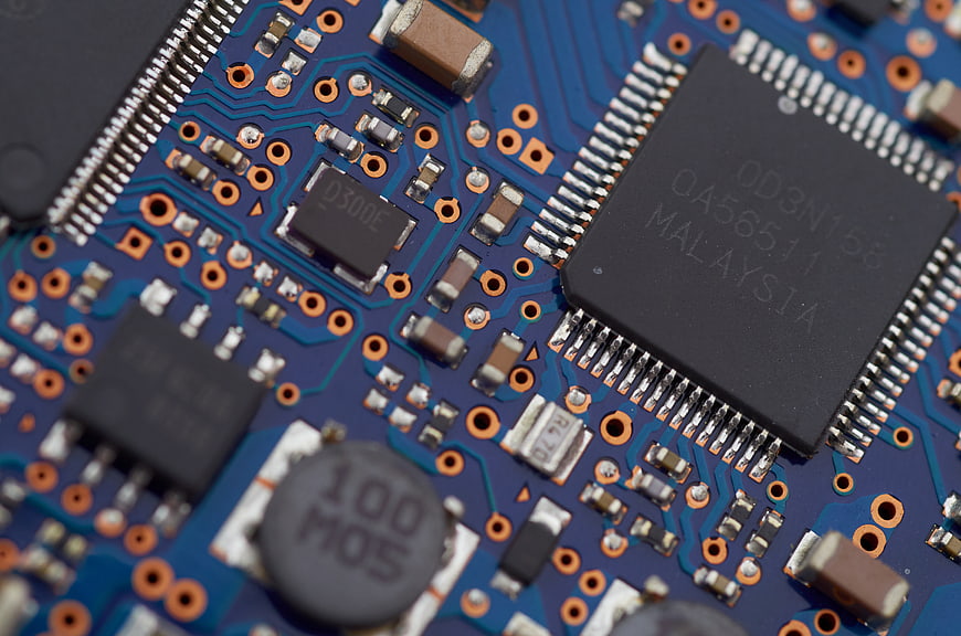 Macro Close-Up of Blue Computer Circuit Board Components