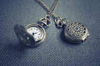 Vintage Silver Pocket Watch Pendants on Blue Denim