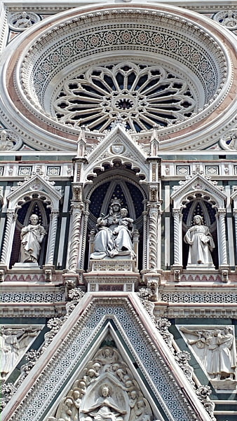 Detailed facade of Florence Cathedral with rose window and statues