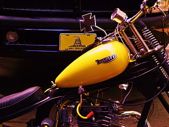 Yellow Triumph Chopper Motorcycle with Don't Tread On Me License Plate