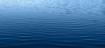Calm Blue Water Surface Texture With Gentle Ripples