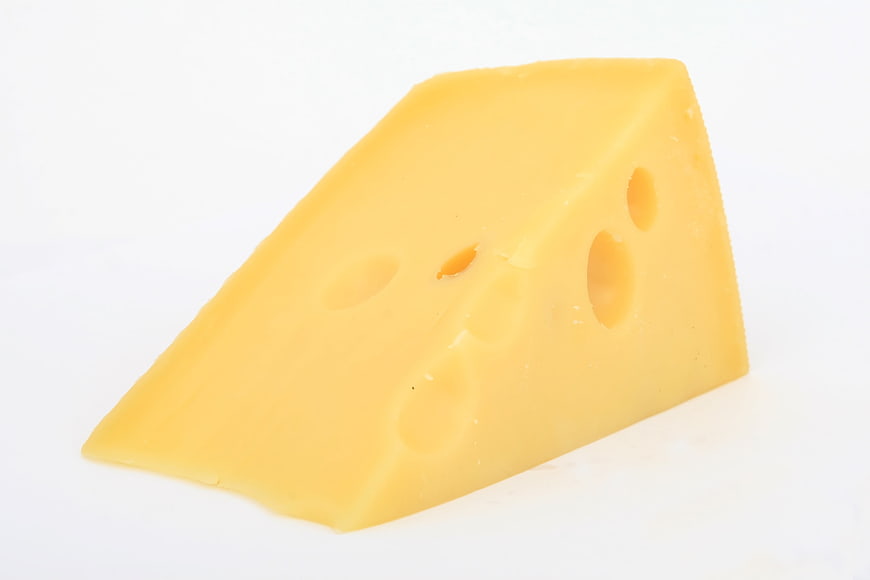 Wedge of Swiss Cheese with Holes on White Background