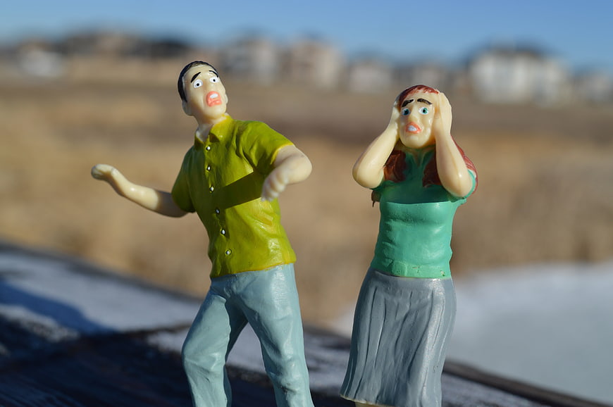 Stressed Couple Figurines Arguing Outdoors