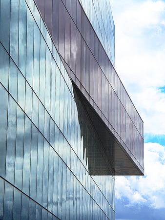 Modern Glass Office Building Facade with Sky Reflection