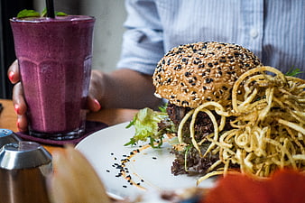 Vegan Burger with Onion Strings and Purple Smoothie